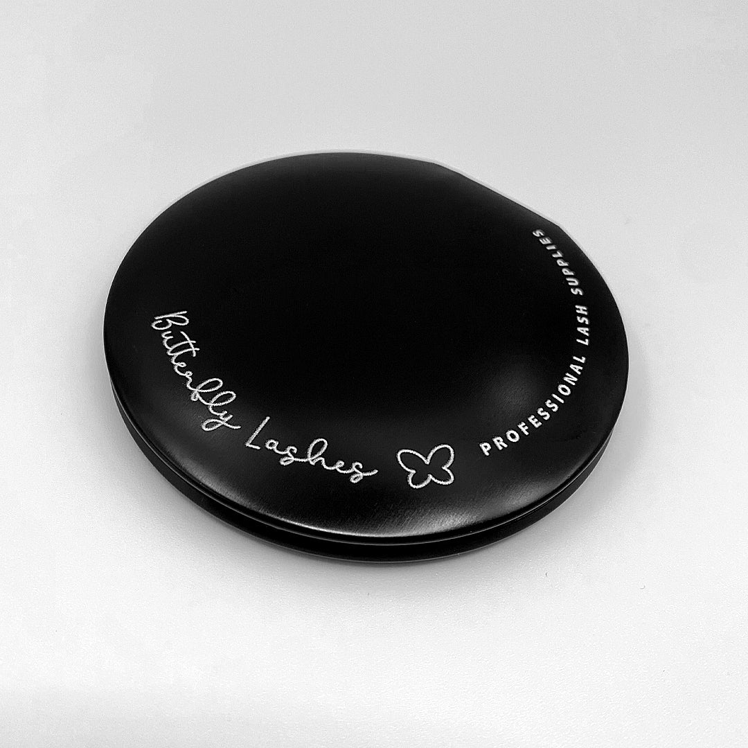 round black compact mirror