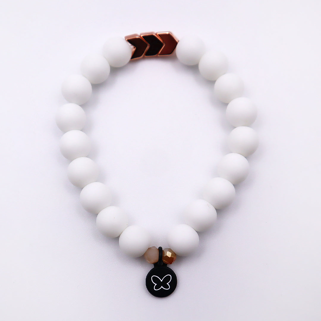 White beaded bracelet with rose gold accents and butterfly charm