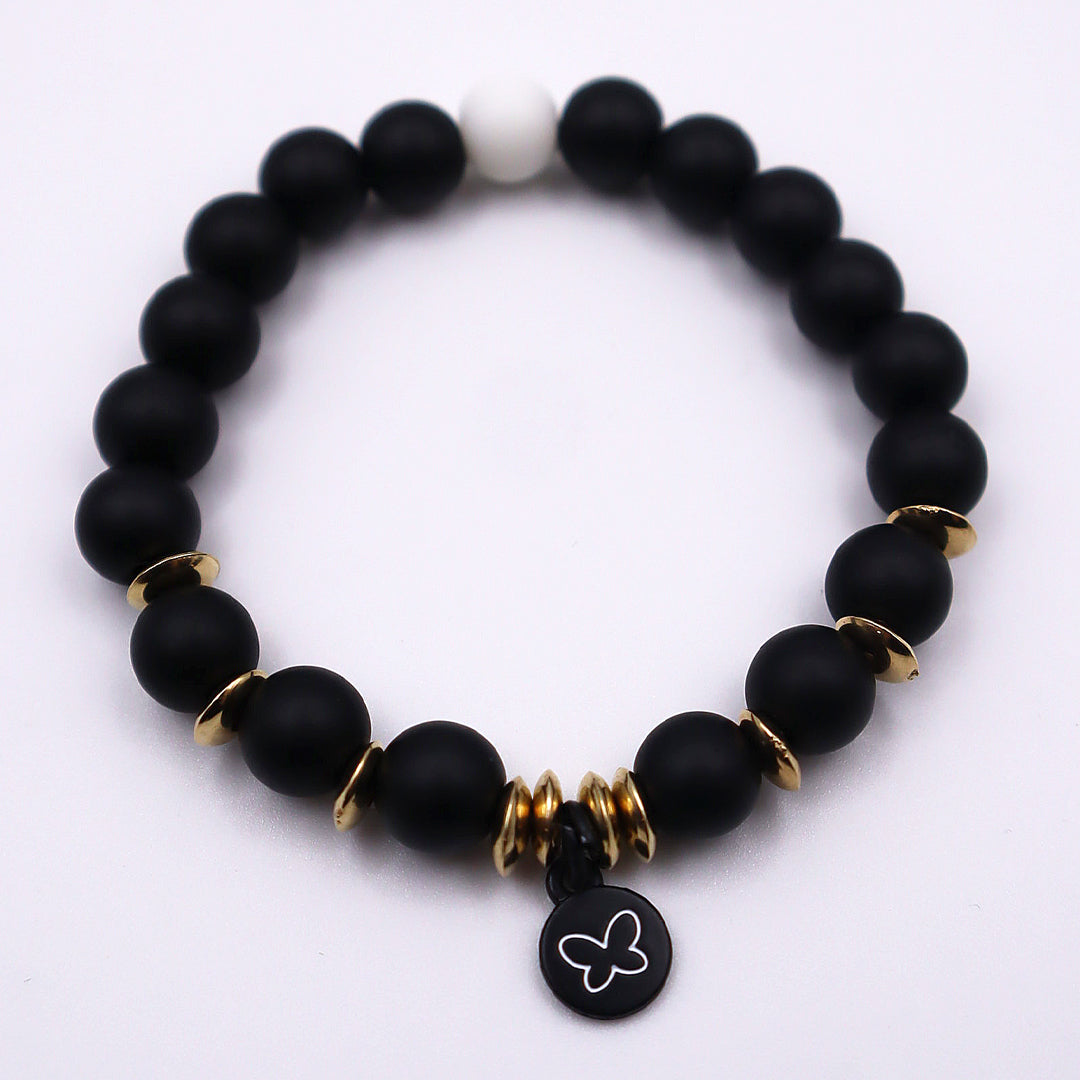 Black beaded bracelet with gold accents