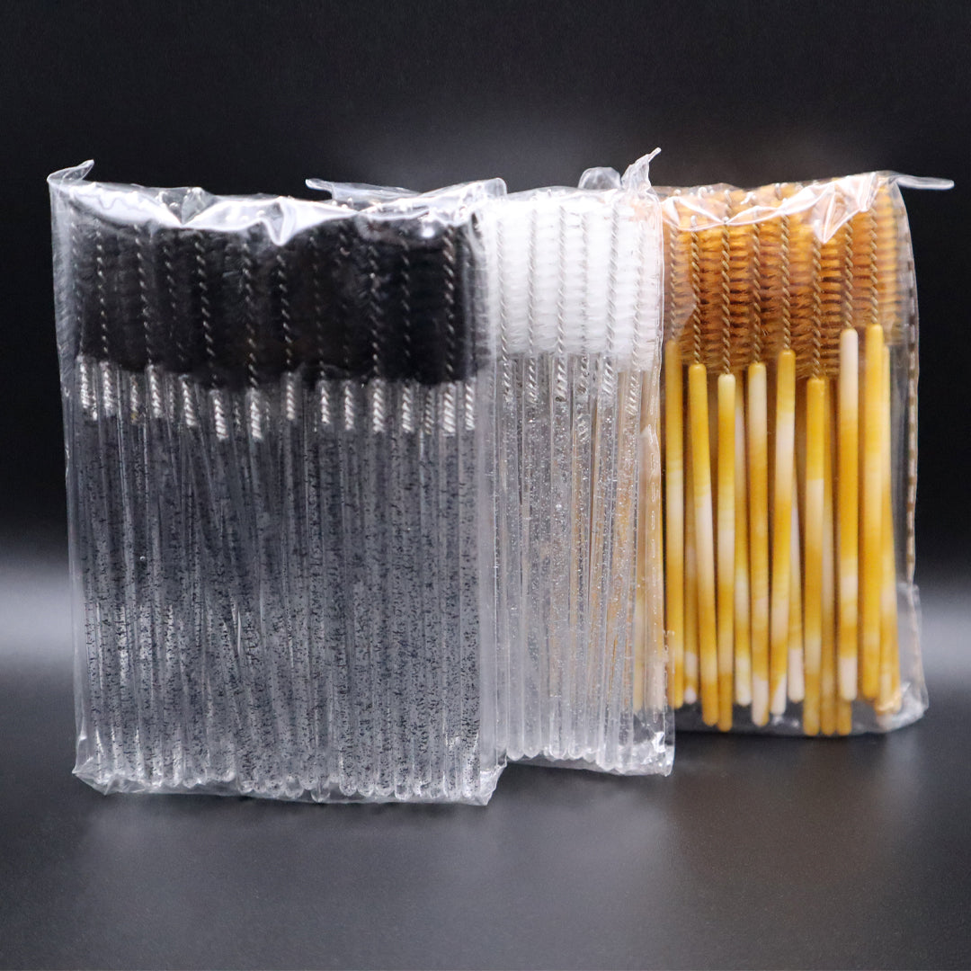 black, white, and gold mascara wands