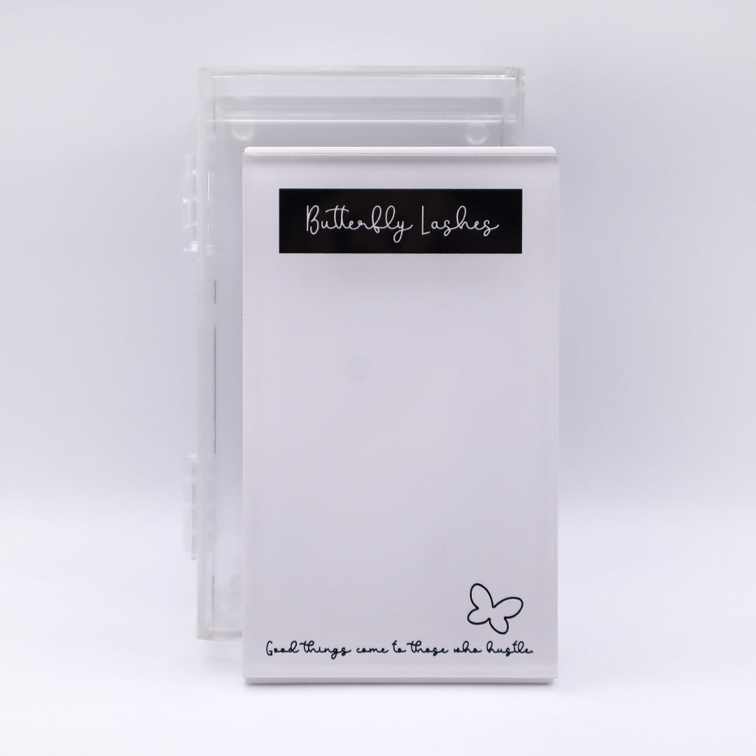 white tile with black writing and clear case