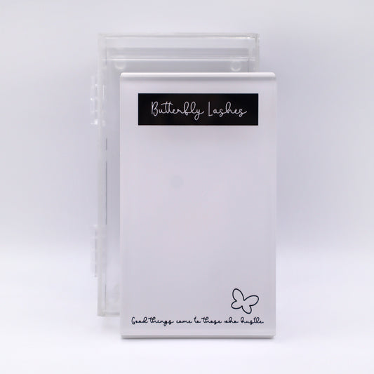white tile with black writing and clear case