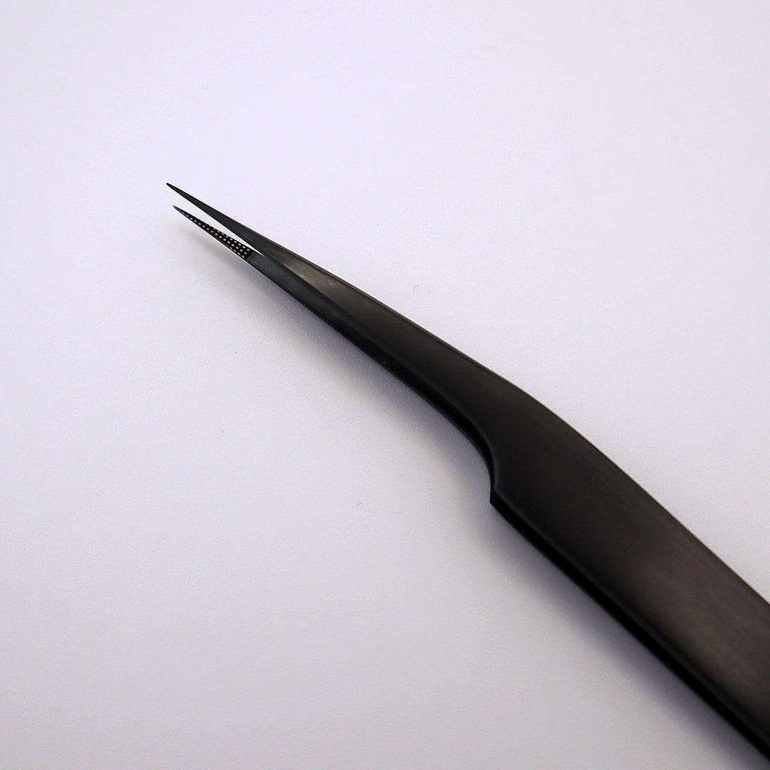 tip of black isolation fiber tweezer